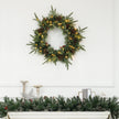 60cm Christmas Wreath hanging in a festive room