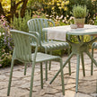 Echo French grey chairs around a bistro table in a garden