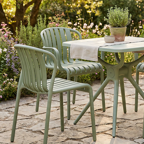 Echo French grey chairs around a bistro table in a garden