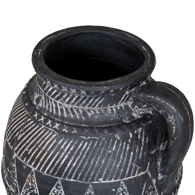 Looking into the jug's opening and handle