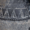Close-up of the white etched triangle pattern