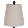 Grey linen shade and black finial close-up