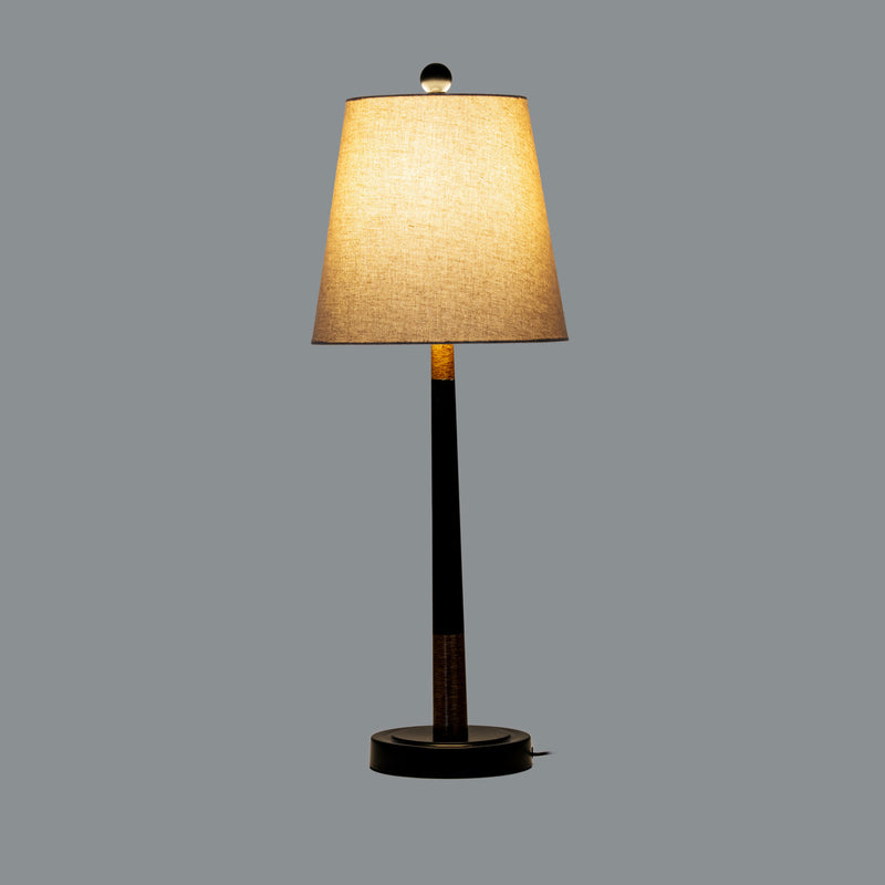 Everly table lamp switched on against a grey background