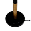 Close-up of the round black base and cable