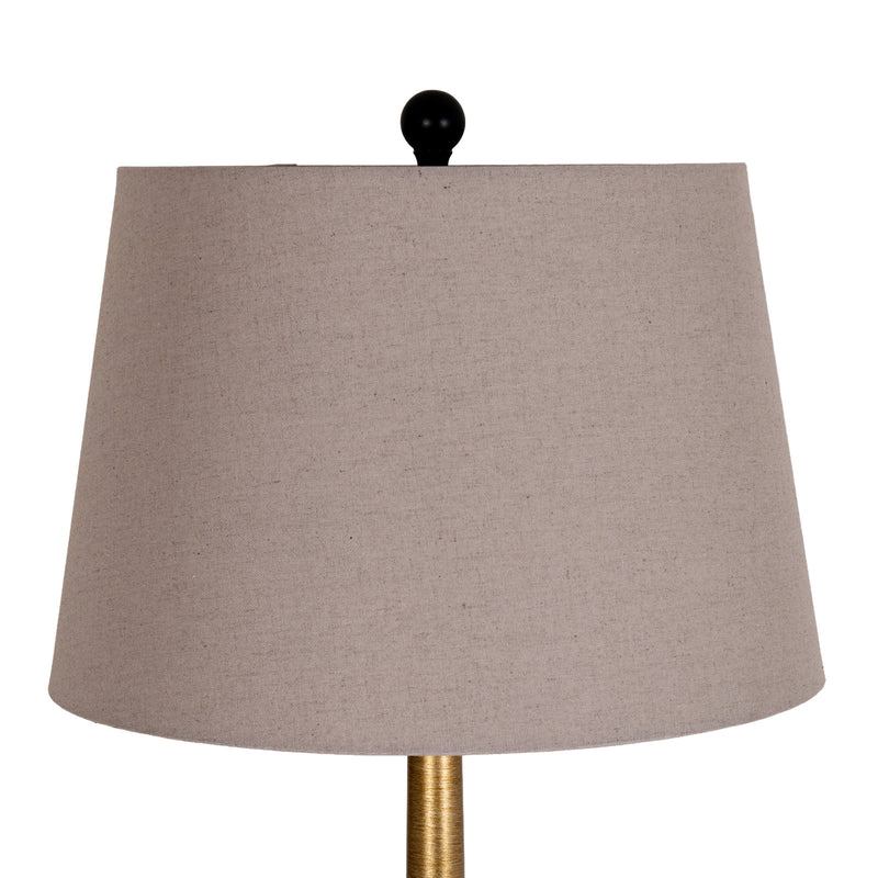 Close-up of the grey linen shade and finial