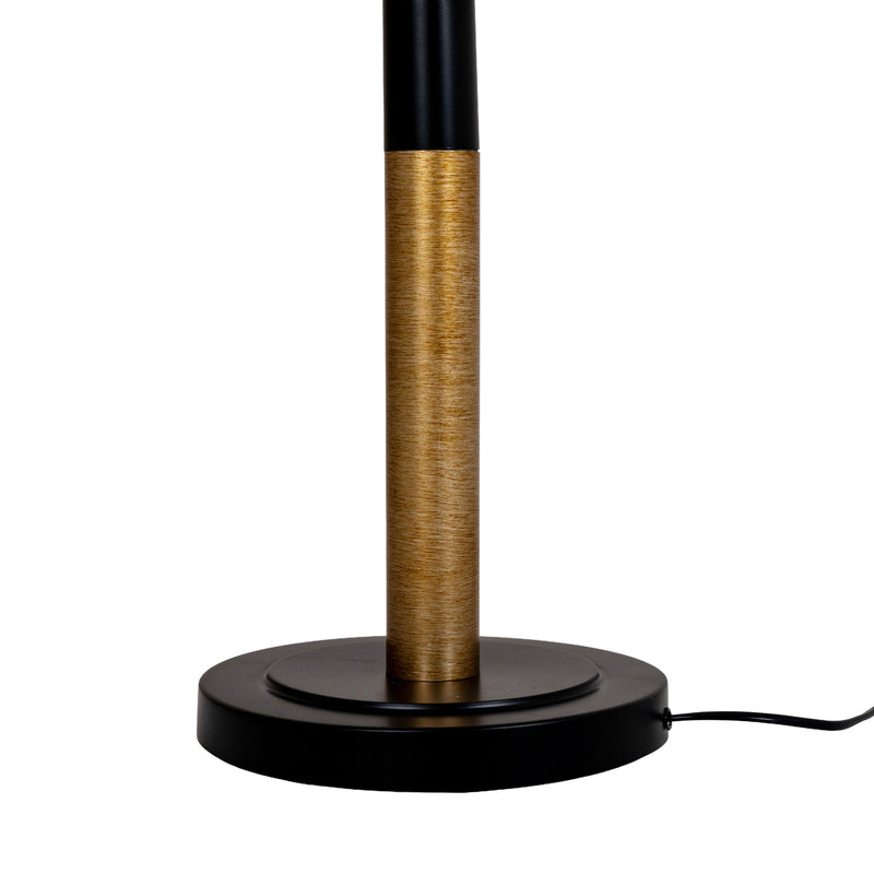Black and gold stem meeting the round black base