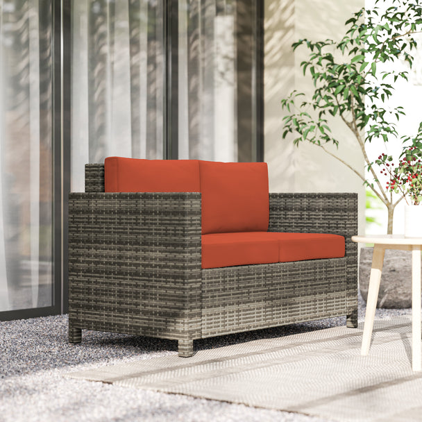 Grey & orange rattan garden sofa – image 2