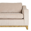 close-up of the arm, cushions and wooden plinth