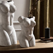 Two female figure vases side by side on a shelf, each sold singly