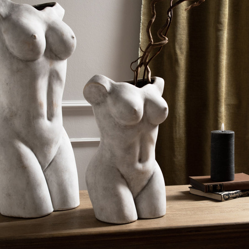Two female figure vases side by side on a shelf, each sold singly