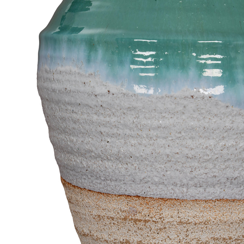 Close-up of the teal glaze, white band and terracotta base