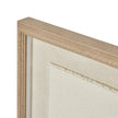 Close-up of the beaded wood frame and torn paper edge