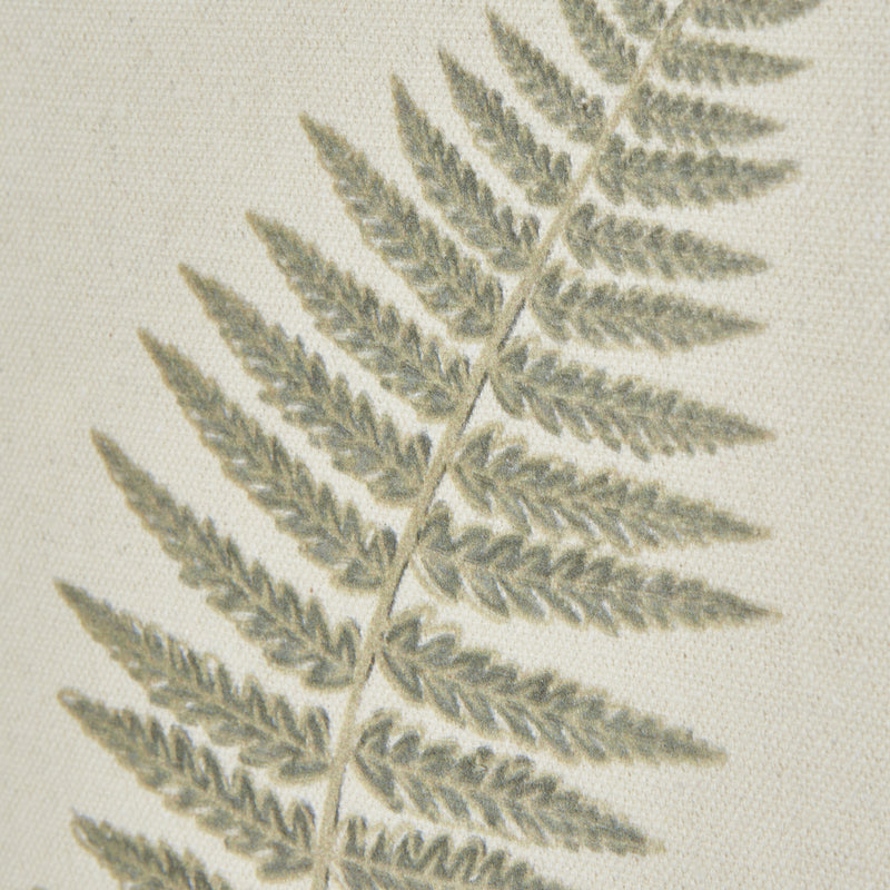 Close-up of the fern frond on textured paper