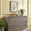 Fern framed art above a grey chest of drawers