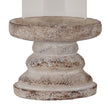 Close-up of the weathered ceramic pillar base