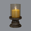 Ferro large hurricane lantern lit with a pillar candle