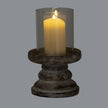 Ferro medium hurricane lantern lit with a pillar candle