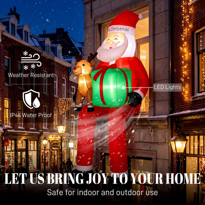 Illuminated 9.3ft hanging Santa and reindeer Christmas inflatable at night