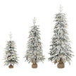 Set of three snow-flocked pre-lit pencil Christmas trees with warm white LEDs on fabric-wrapped bases