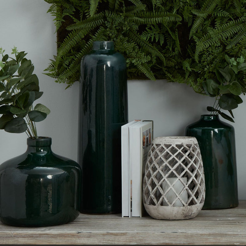 Emerald glazed vases grouped on a shelf, other vases sold separately