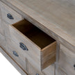 close-up of an open drawer and cup handle