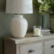 close-up of a lamp and candle on the Haldon chest top
