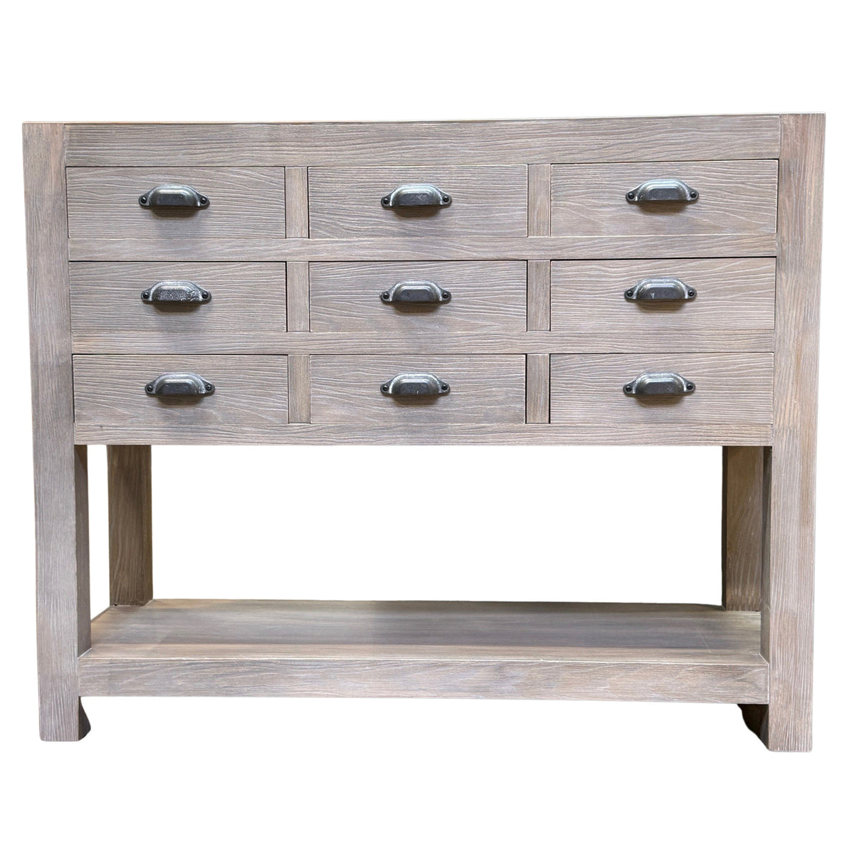 Haldon nine-drawer chest with open lower shelf on white