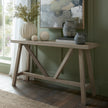 Haldon console styled with vases against a green wall