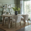 Apex bookcase behind a wooden dining table