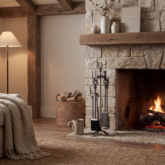 Loop-top companion set beside a lit fireplace