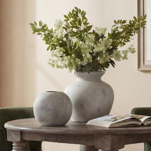 Antique White Greek-Style Ceramic Vase – 30cm, styled with flowers beside a smaller vase