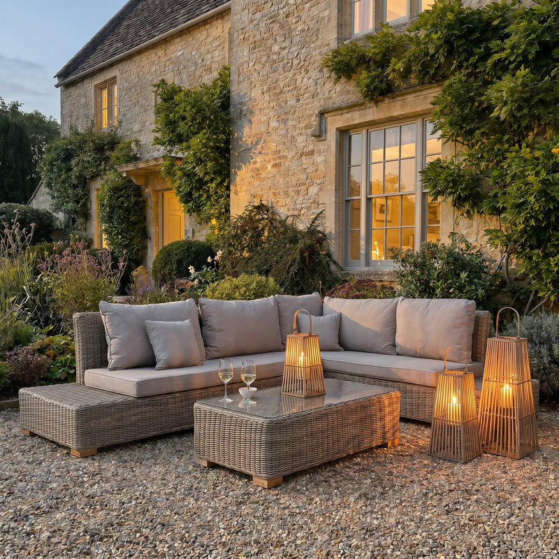 Large Wicker Silo Lantern with Glass Holder – 88cm, two lantern sizes beside a patio sofa