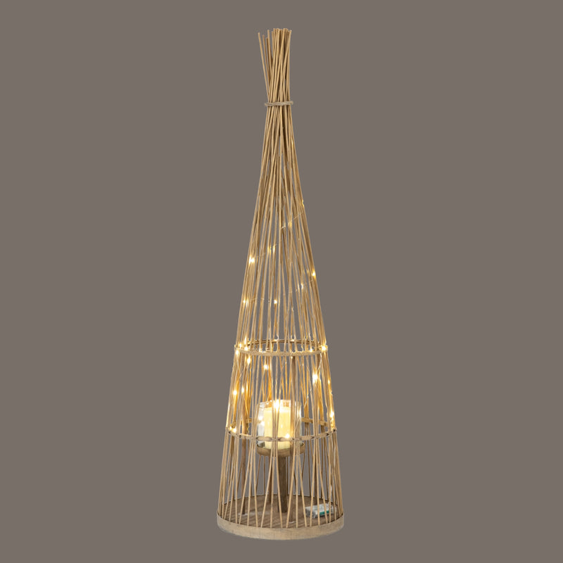 Tall Conical Wicker LED Lantern – 130cm, illuminated lantern against a dark background