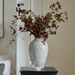 White Olpe Ceramic Vase – 30cm, styled with foliage on a cabinet