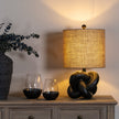 Black Knot Table Lamp with Hessian Shade – 51cm, styled illuminated view