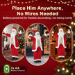 Santa figure displayed beside a Christmas tree