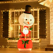 8ft Santa and Snowman Hot Air Balloon Christmas Inflatable displayed outside a decorated home