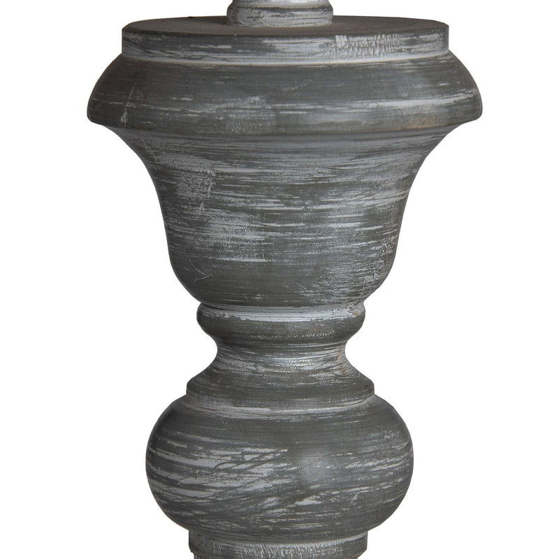 Close-up of the carved, grey washed wooden base
