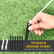 Ground stakes and tether ropes for securing the inflatable