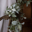 Lamb's ear garland draped over a wooden chair back