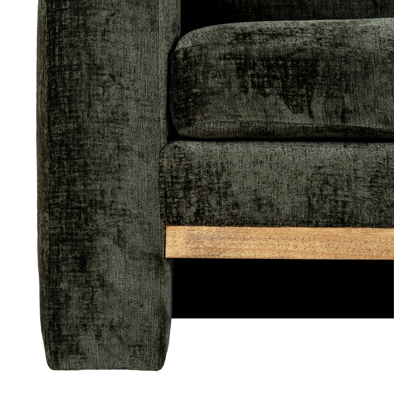 close-up of the rounded arm and wooden base trim