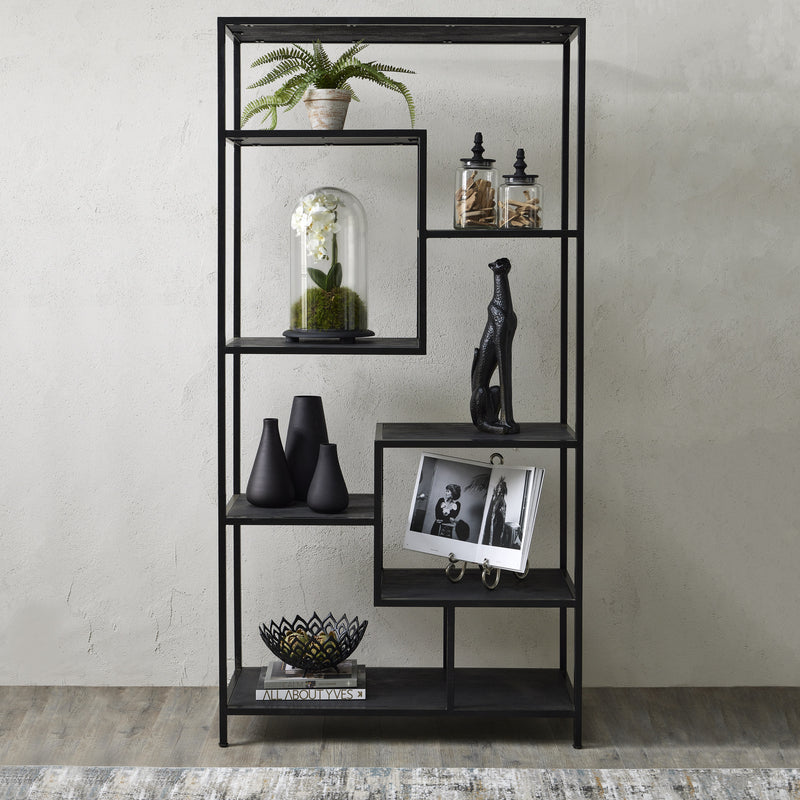Black multi shelf unit styled with vases and frames
