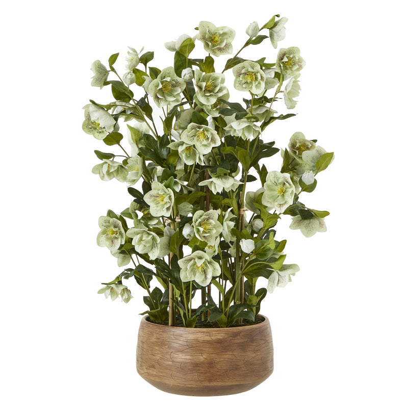 large green artificial hellebore in a taupe pot