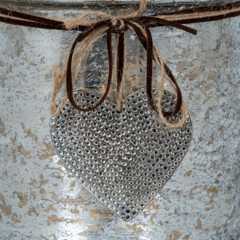 Close-up of the hammered-dot heart and twine bow