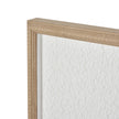 Close-up of the beaded wood-tone frame corner