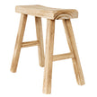 Wooden artisan stool from an angle showing the splayed legs