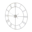 Silver skeleton wall clock seen from an angle