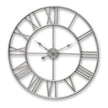 Large silver metal skeleton wall clock with Roman numerals