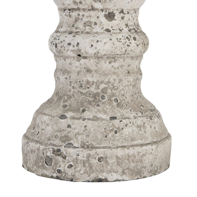 Close-up of the pitted stone-effect finish on the base