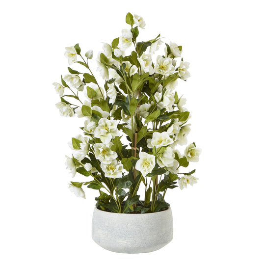 large white artificial hellebore in a grey pot